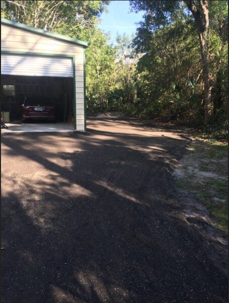 Paved asphalt millings home driveway