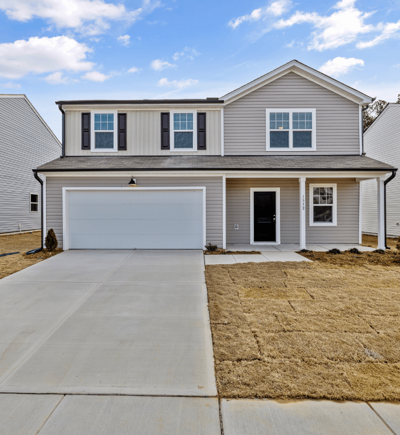House with driveway leading to garage